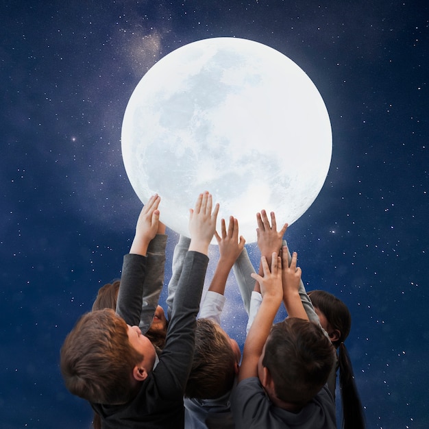 Free photo children holding moon