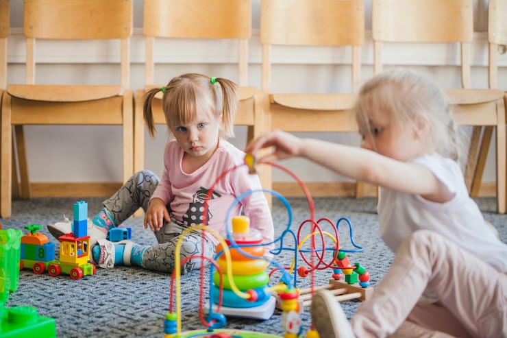 Free Photo children in kindergarten with toys