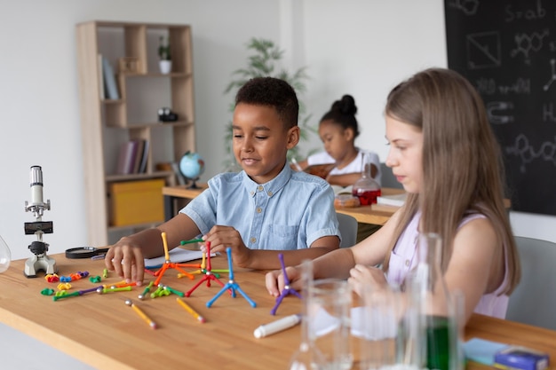 Children learning more about chemistry in class