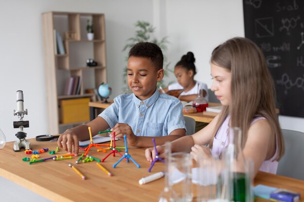 Children learning more about chemistry in class