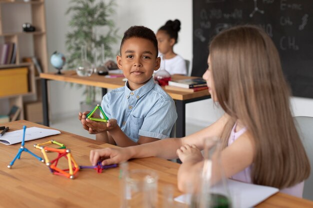 Children learning more about chemistry in class