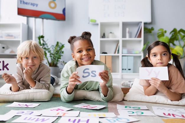 Children learning together how to speak in therapy