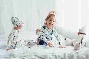 Free photo children in pajamas