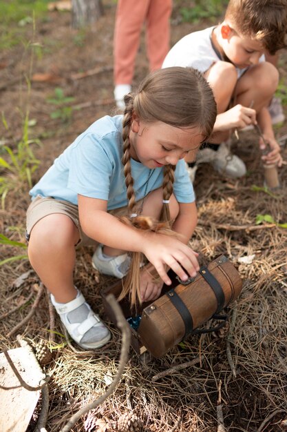 Children participating together as a team in a treasure hunt