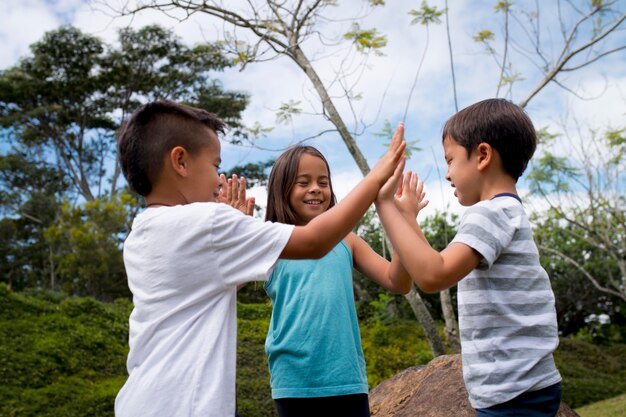 Children participating in a treasure hunt outside