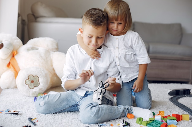 Children playing with lego in a playing room