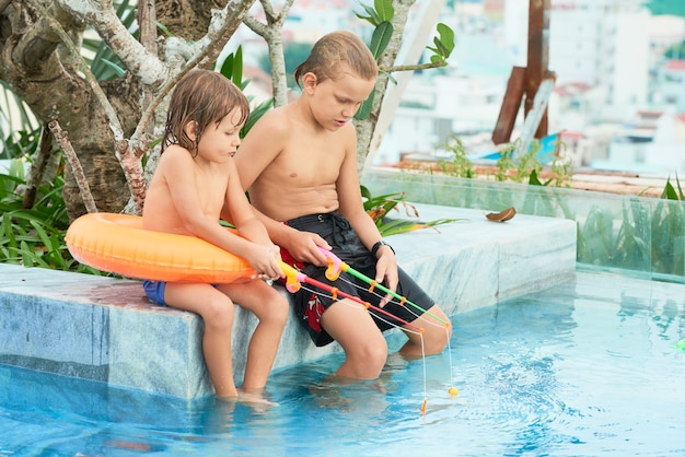 Children playing with toy rods