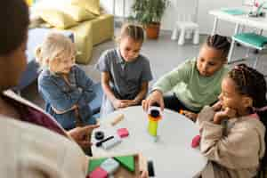 Free photo children playing with a wooden game