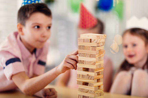 Children playing wooden game