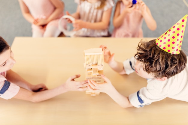 Children playing wooden game