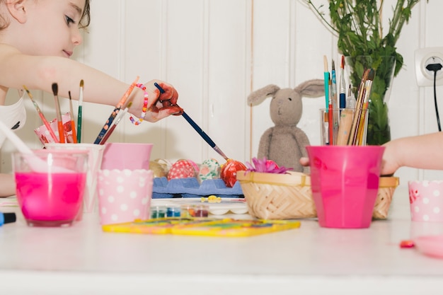 Children prepaing eggs for Easter