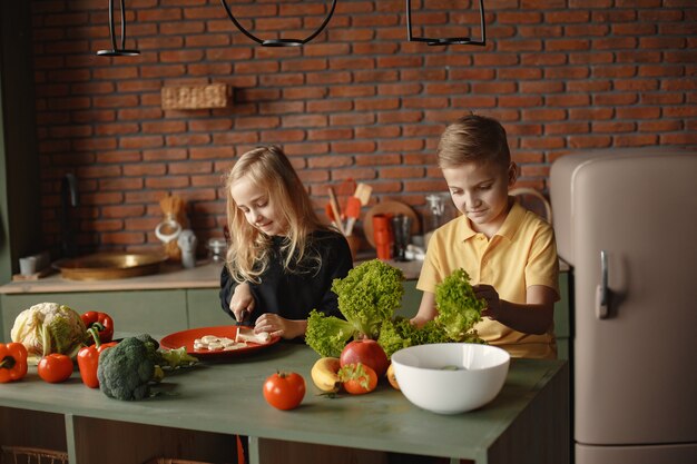 Children prepare salan in a kitchen