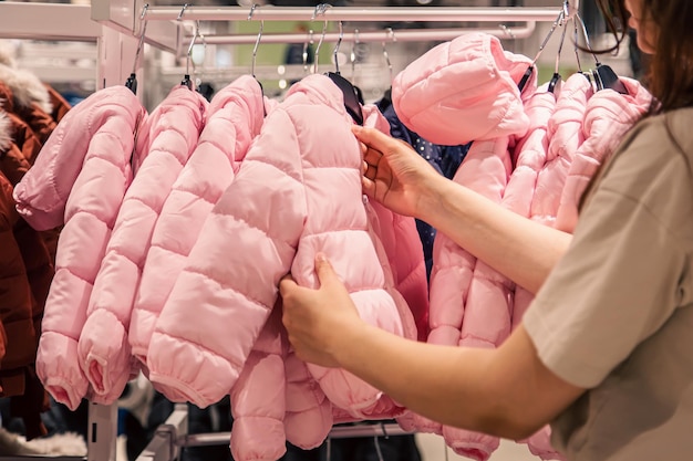 Free photo children's jackets on hangers in a clothing store