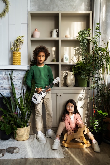 Free photo children spending time together in the comfort of their home