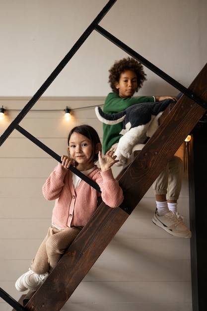 Free photo children spending time together in the comfort of their home