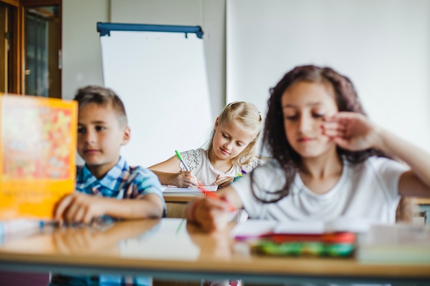 Free photo children studying in classroom