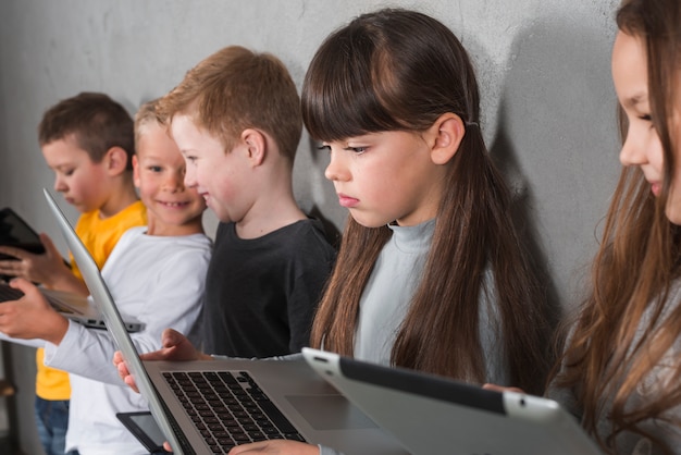 Children using electronic devices