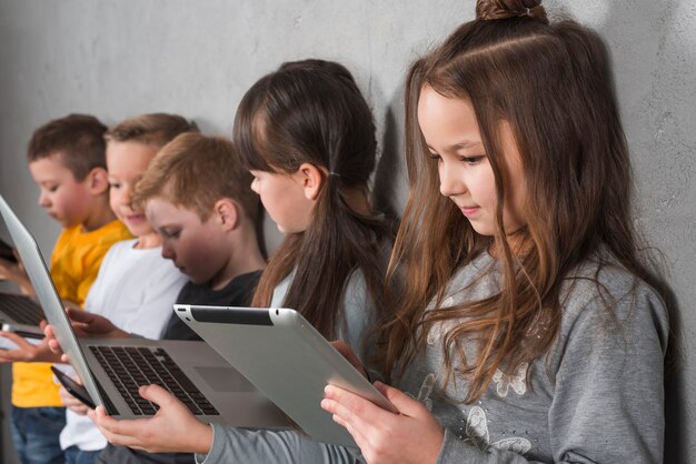 Children using electronic devices