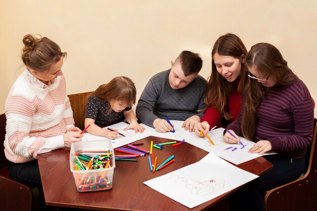 Children with down syndrome drawing together