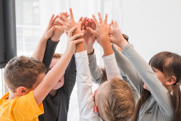 Children with their hands up