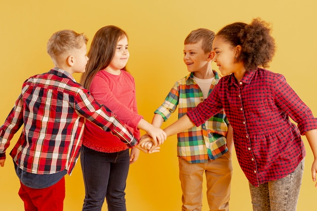 Free photo childrens doing hand shake