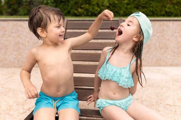 Free photo childrens eating cherries