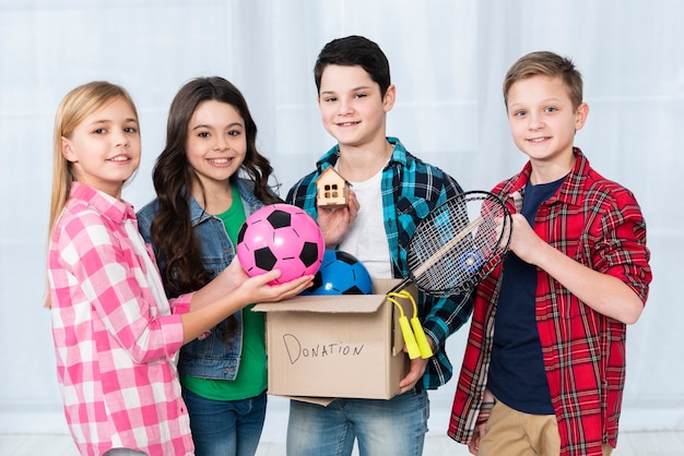 Childrens holding donation box