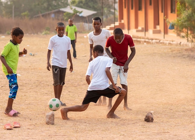 Childrens playing football