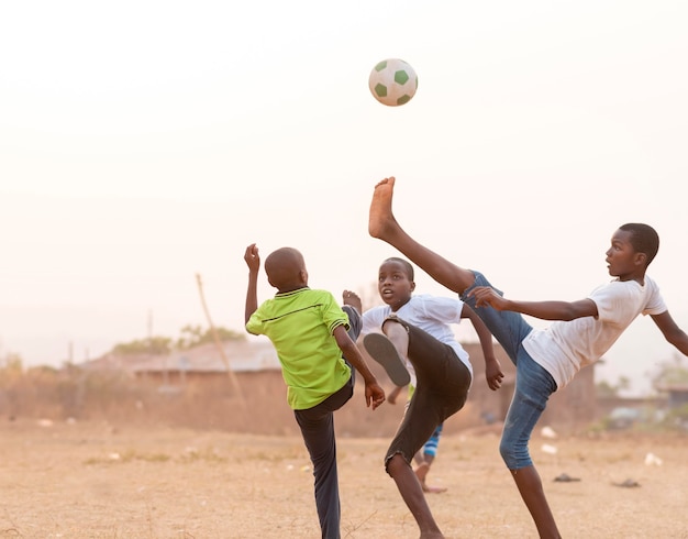 Childrens playing football