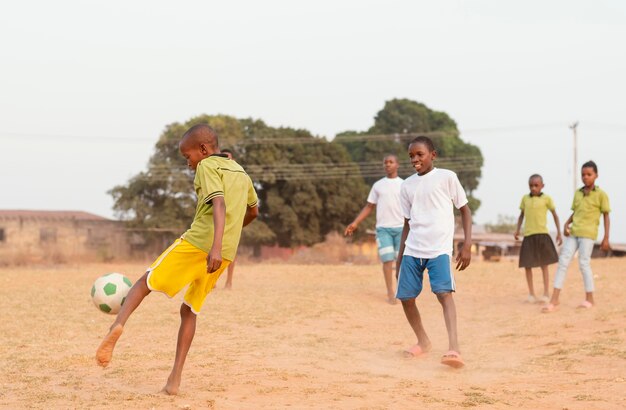 Childrens playing football