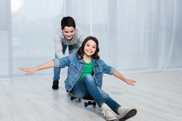 Childrens riding skateboard