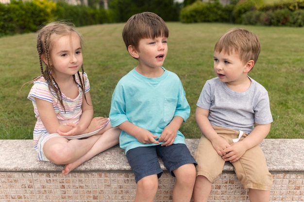 Childrens sitting on bench