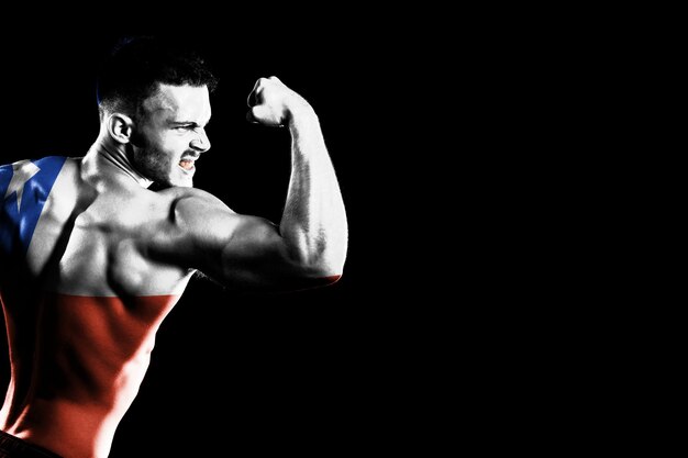 Chile flag on handsome young muscular man black background