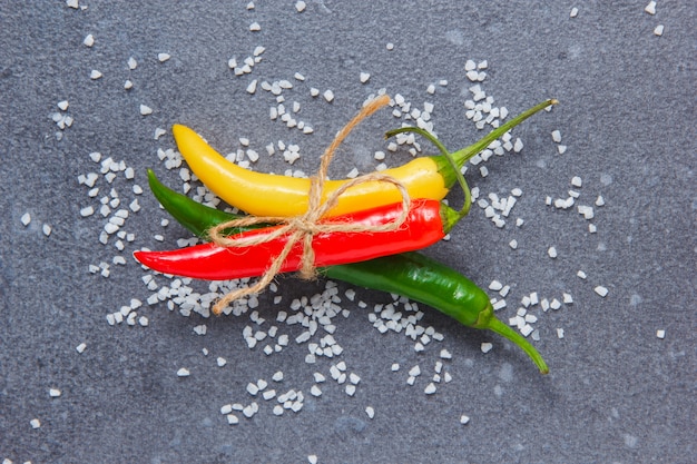 Free photo chili peppers on a gray surface. top view.