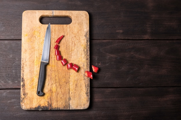 Chilli and knife with chopping block