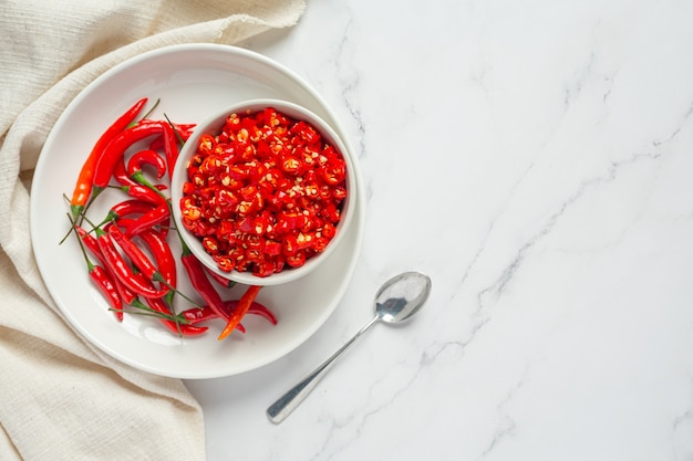 Chilli pepper on white surface