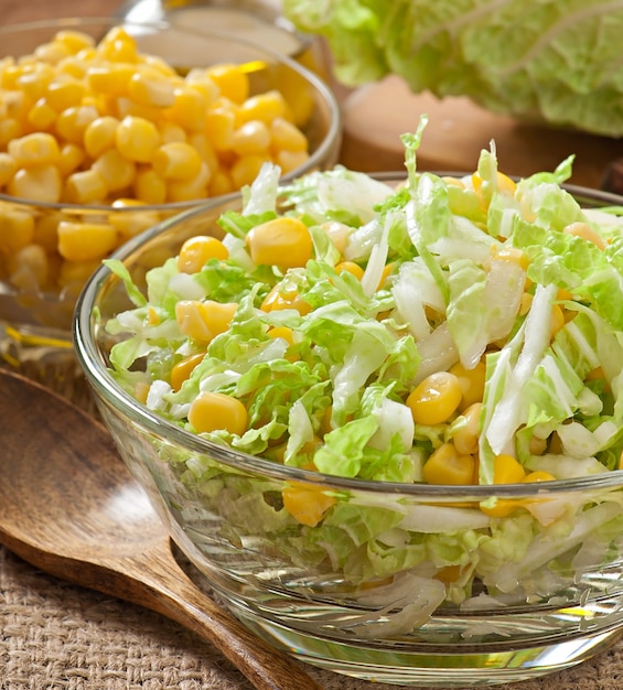 Chinese cabbage salad with sweet corn in a glass bowl