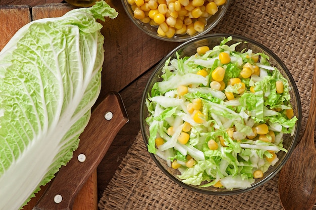 Chinese cabbage salad with sweet corn in a glass bowl