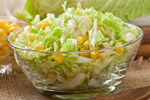 Chinese cabbage salad with sweet corn in a glass bowl