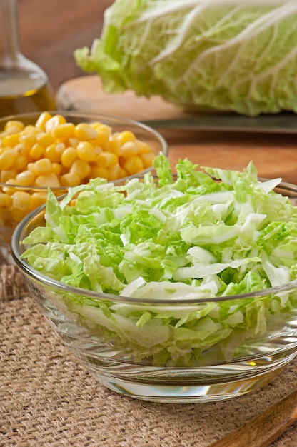 Chinese cabbage salad with sweet corn in a glass bowl