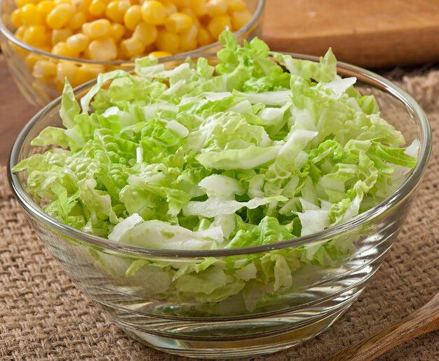 Chinese cabbage salad with sweet corn in a glass bowl