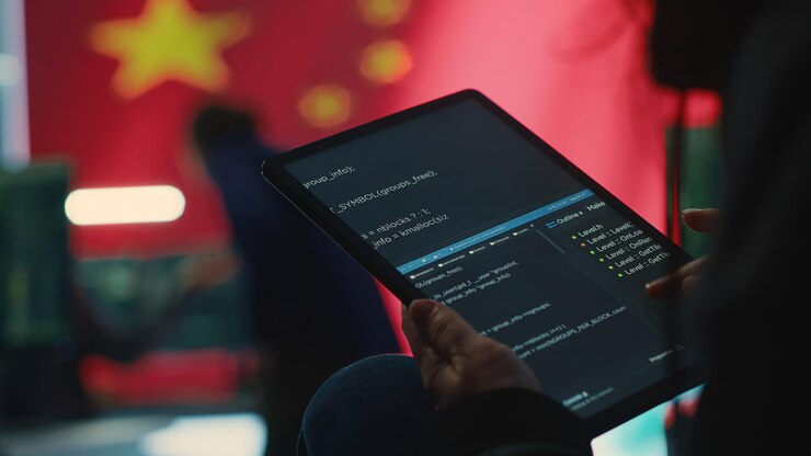 Free Photo chinese hacker uses a tablet in governmental cyber operations office