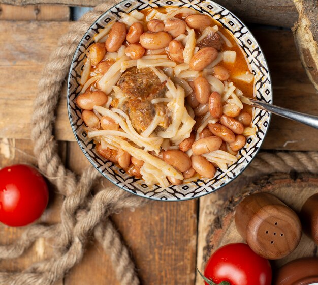 Chinese noodle with beans in the bowl. Top view.