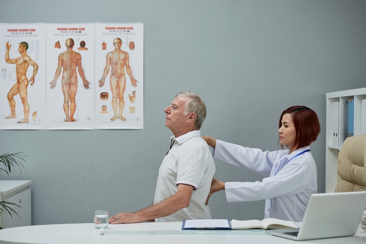 Free Photo chiropractor checking spine