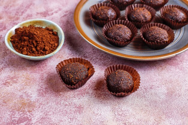 Chocolate balls with cocoa powder.