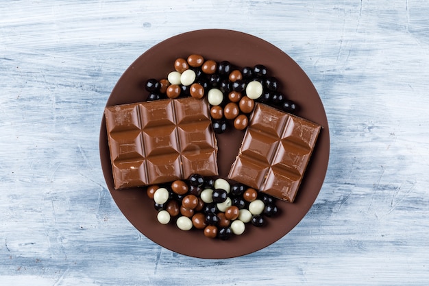 Chocolate bars with chocoballs in a plate