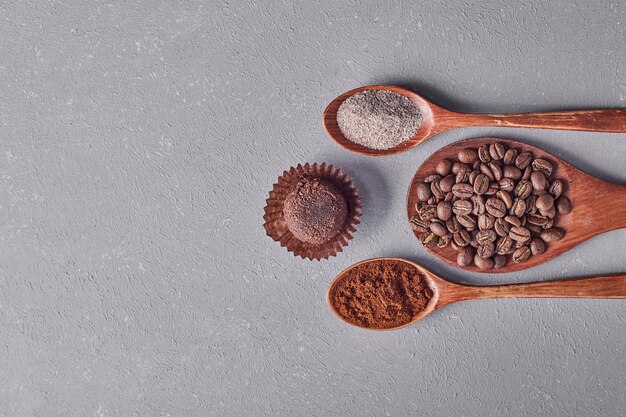 A chocolate bun with arabica beans and powders.