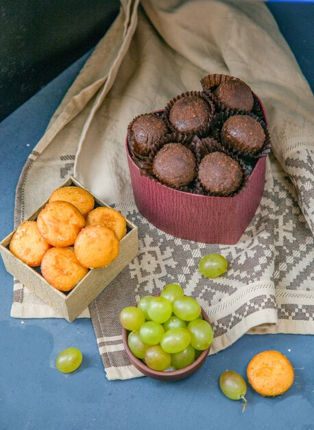 Chocolate buns and cookies with grapes.