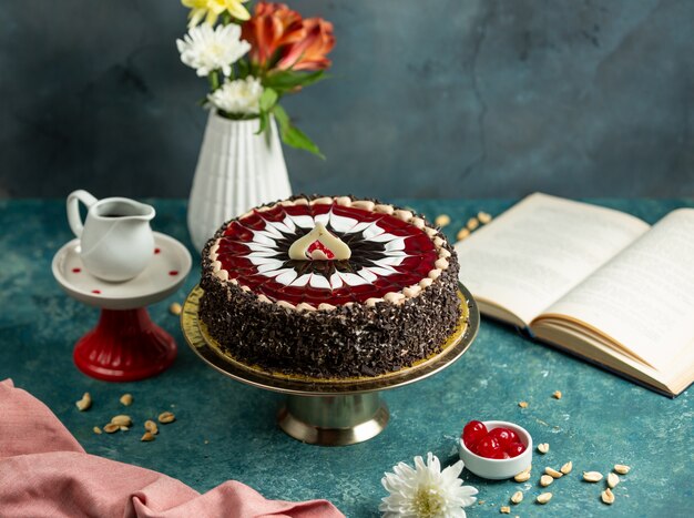 Chocolate cake decorated with red and white glaze