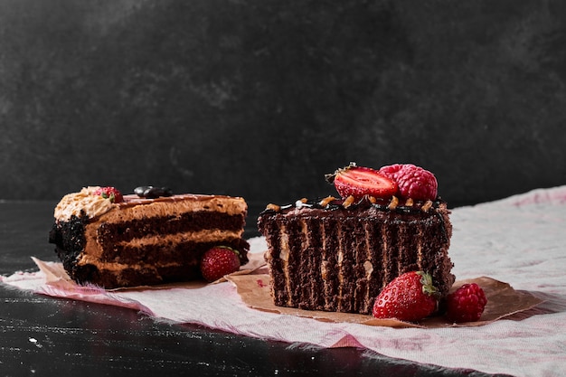 Chocolate cake slice on black